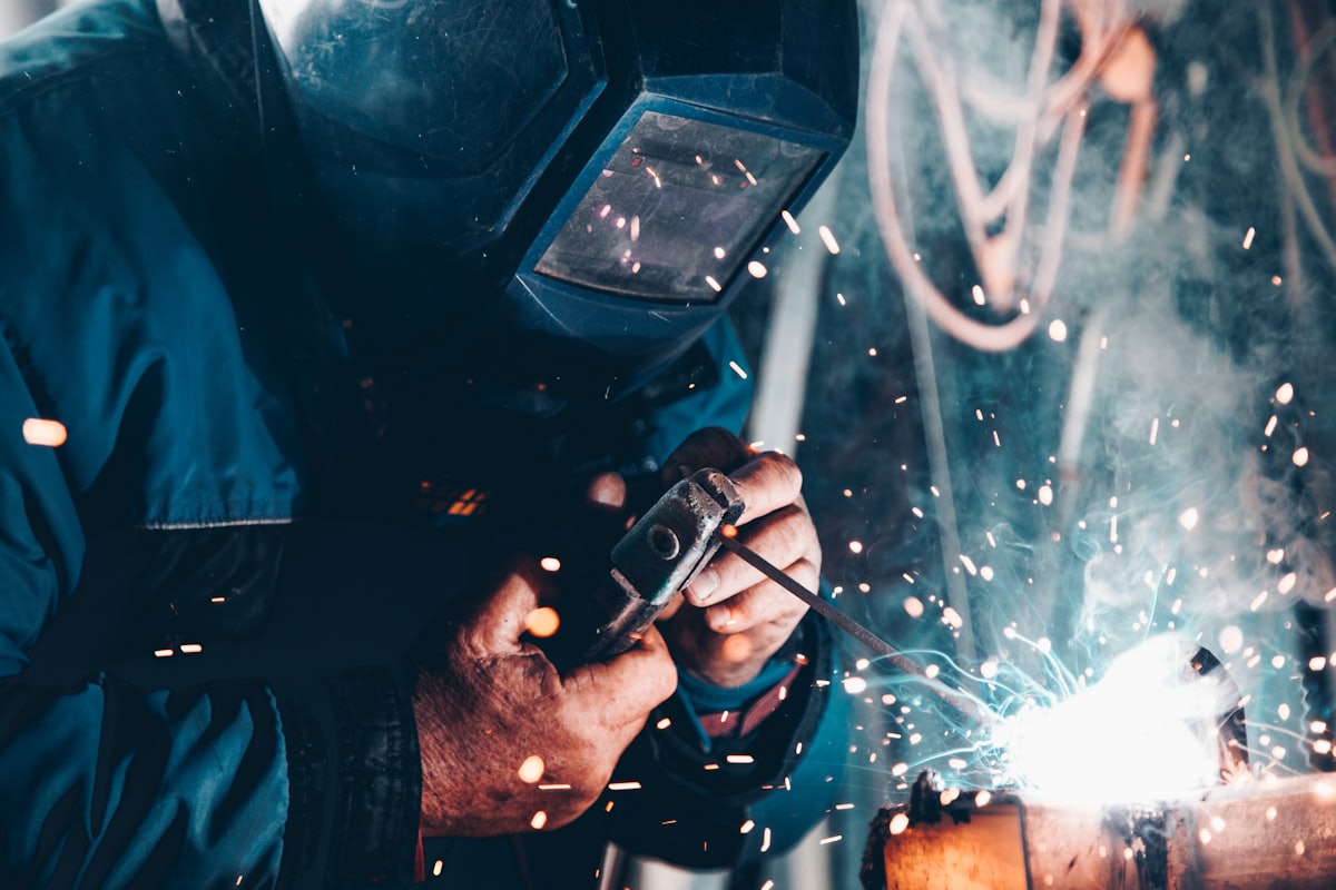 Welder working with sparks flying