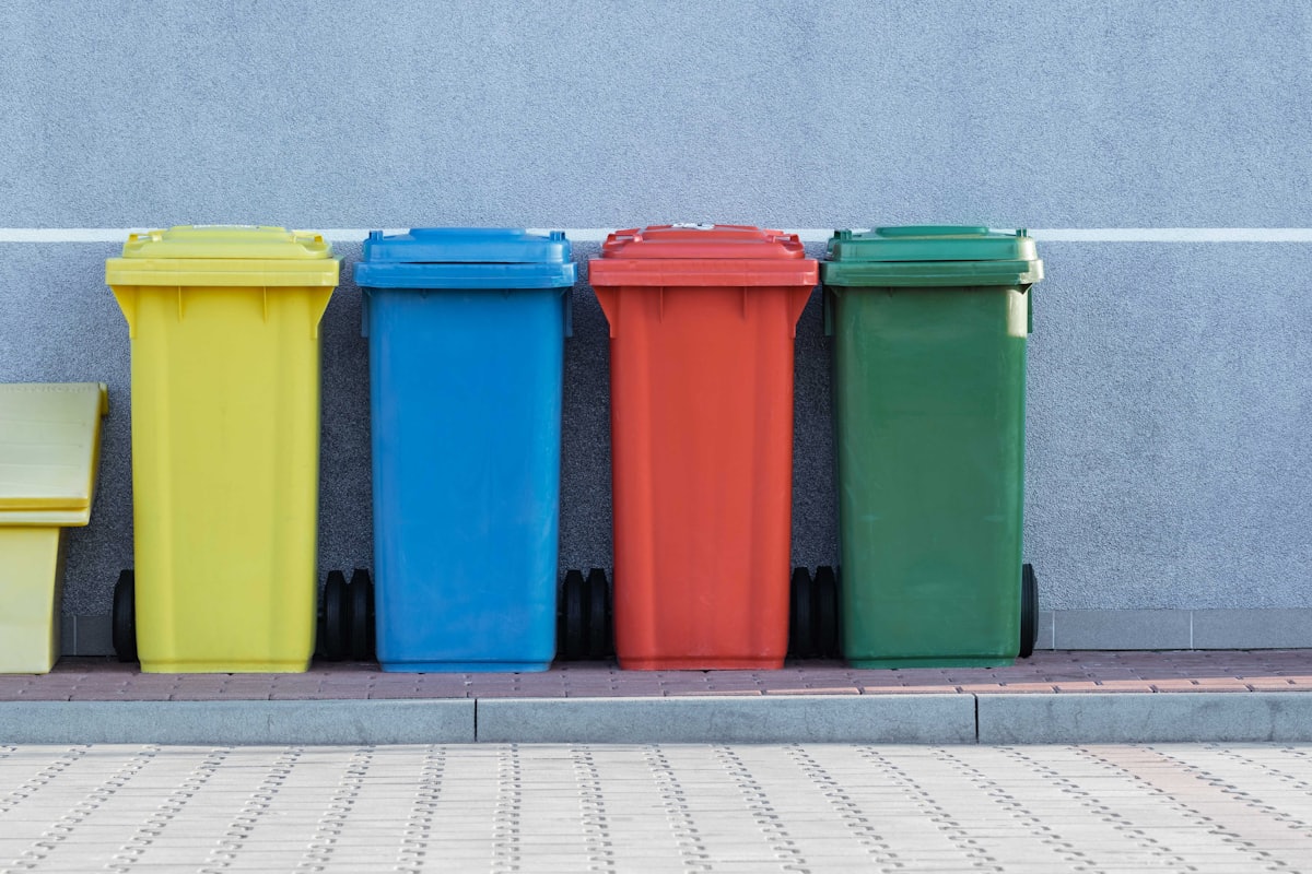 Row of colourful recycling bins
